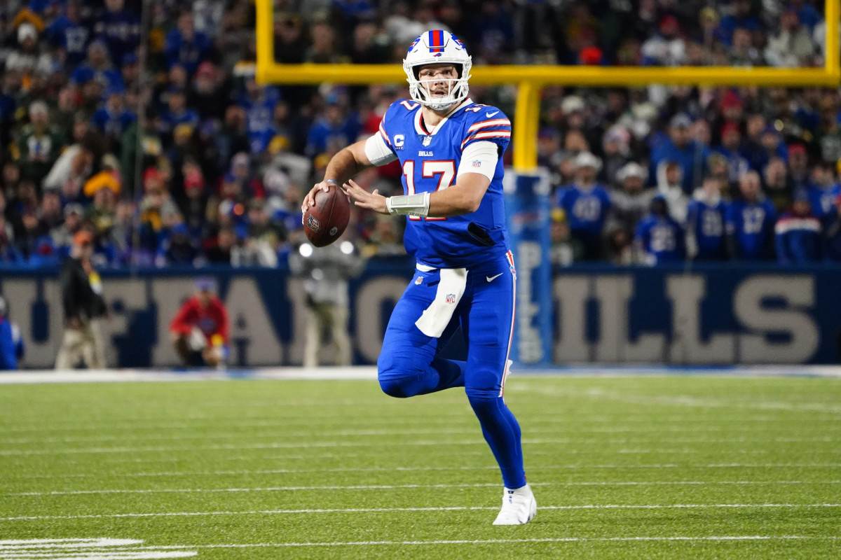 Bills' quarterback Josh Allen looks to throw on the run in a 2022 SNF game